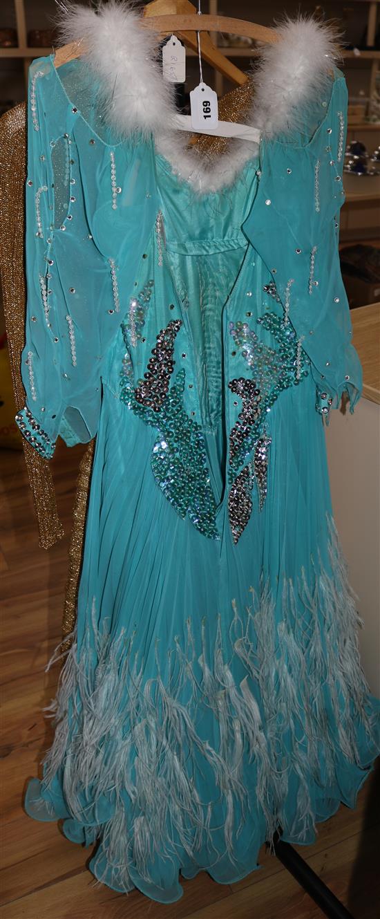 An early 1960s turquoise chiffon beaded and feather trimmed ballroom dress